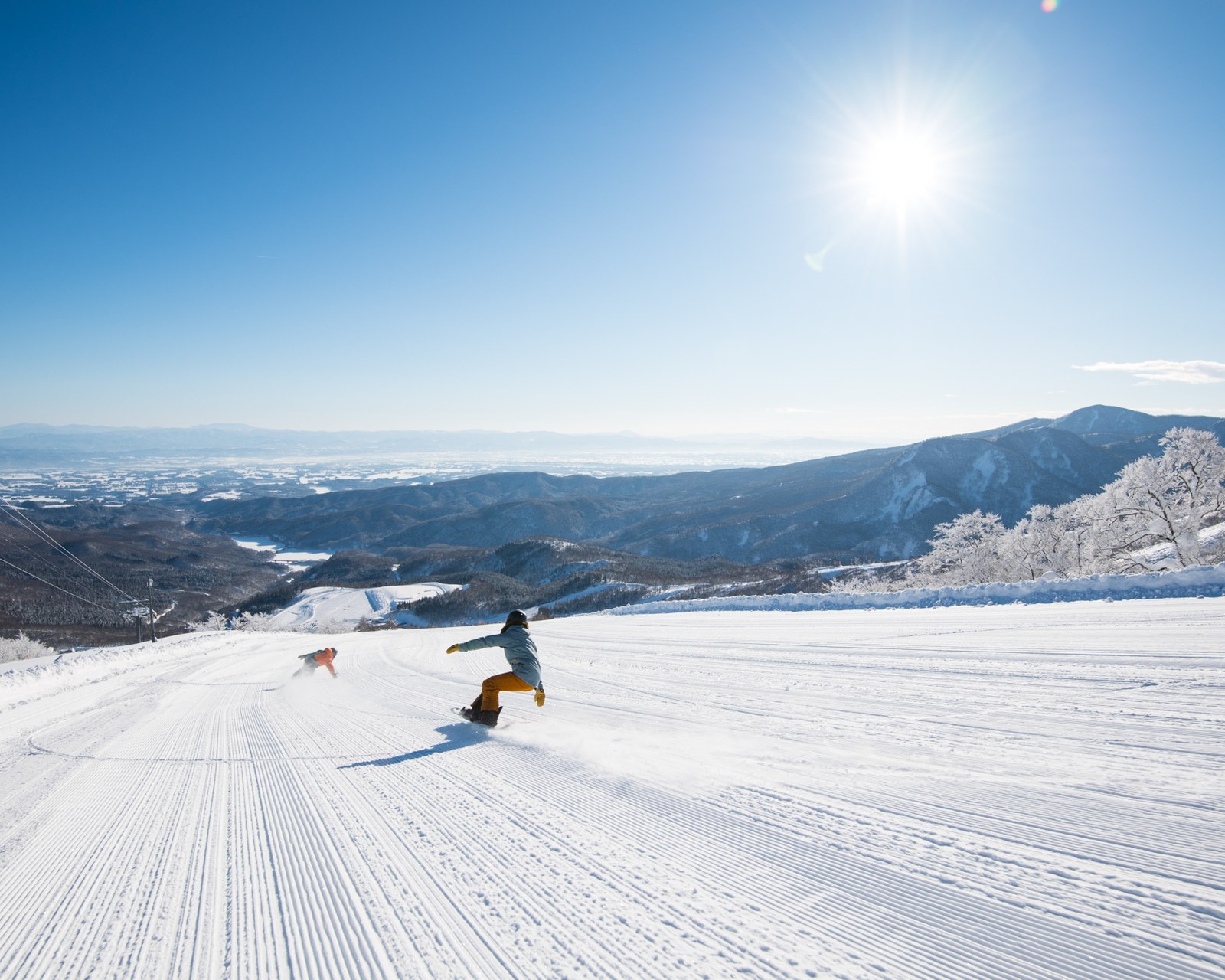 Private snowboard coaching in deep Japanese powder